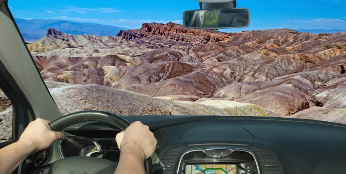 Driving a car towards Zabriskie Point, scenic place in Death Valley, California, USA