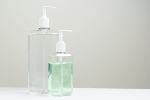Two hand sanitizer in plastic bottle isolated on white background