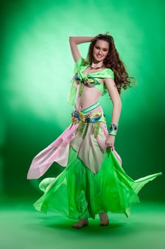 Young woman dressed in a traditional eastern dancing clothing