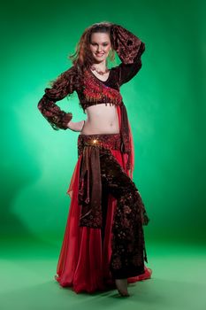 Young woman dressed in a traditional eastern dancing clothing