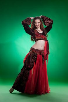 Young woman dressed in a traditional eastern dancing clothing