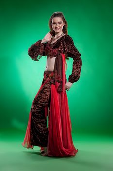 Young woman dressed in a traditional eastern dancing clothing