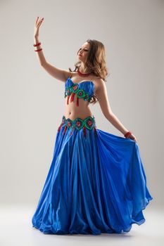 Young woman in traditional eastern dancing clothing