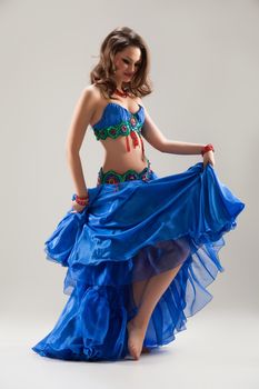 Young woman in traditional eastern dancing clothing