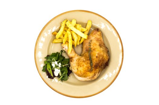 Roasted chicken leg with fries and vegetables on white background
