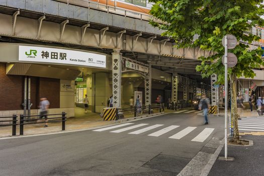 Underpass with metal pillar of the west entrance of Kanda Station on the Yamanote Line. The street extends over 300 meters and has no less than 100 shops.