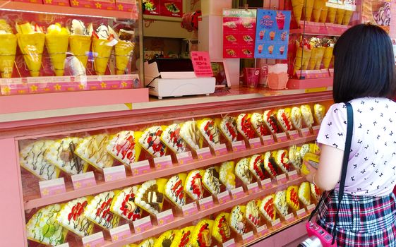 Tokyo, Japan - MAy 29, 2018: Crepe and ice cream vendor at Harajuku's Takeshita street.