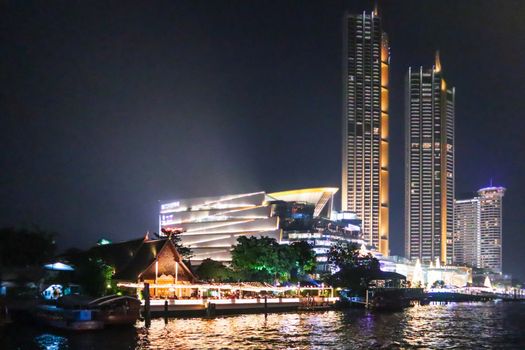 embankment at Chao Phraya River in Bangkok city. cityscape in the evening. Nigt life in asia