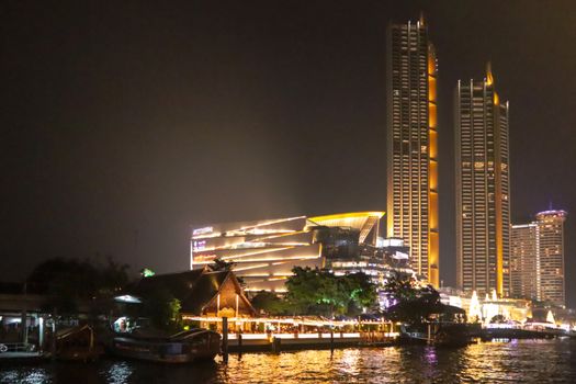 embankment at Chao Phraya River in Bangkok city. cityscape in the evening. Nigt life in asia