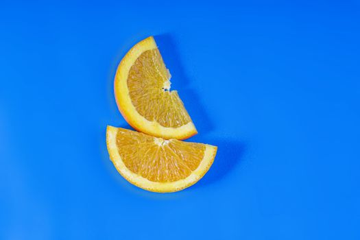 Orange fruit slides on a blue background