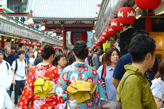 TOKYO JAPAN , MAY 28 2018.Young girl wearing Japanese kimono standing in front of Sensoji Temple in Tokyo, Japan. Kimono is a Japanese traditional garment. 