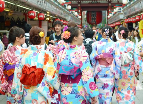 TOKYO JAPAN , MAY 28 2018.Young girl wearing Japanese kimono walking at street in front of  Sensoji Temple in Tokyo, Japan. Kimono is a Japanese traditional garment. 