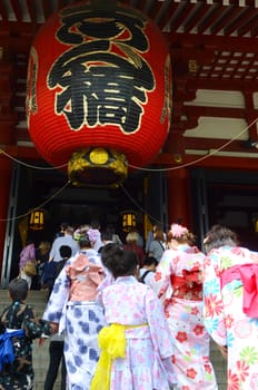 .Japanese family wearing Japanese kimono Tourists come to pay homage to buddha at  Sensoji temple Asakusa, Tokyo.