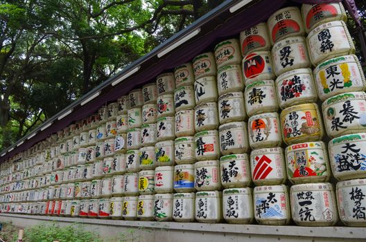 Tokyo, Japan - May 29, 2018: Donated barrels of sake stacked together at Meiji Jingu Shrine in Tokyo.