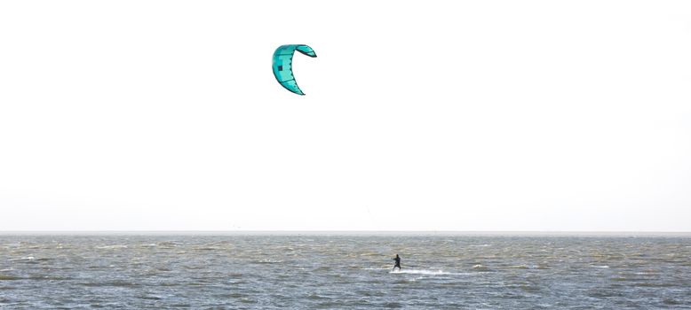 Kitesurfing on the waves of a dutch lake