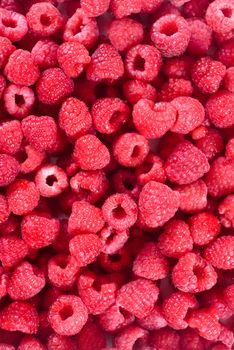 Fresh raspberries background closeup. Ripe Delicious berries. Healthy food organic concept.   