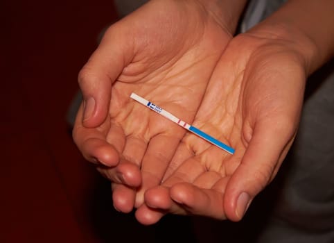 Woman holding pregnancy test, New life and new family concept. Shallow dof