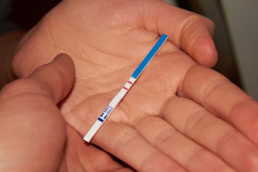 Woman holding pregnancy test, New life and new family concept. Shallow dof