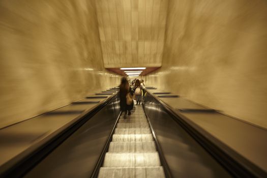 MILAN, ITALY 10 MARCH 2020: Escalators go down to the Milan metro with movement effect