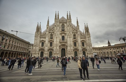 MILAN, ITALY 10 MARCH 2020: Milan Cathedral with tourists and people strolling en masse on the square