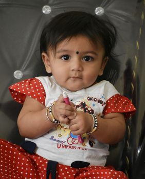 A cute Baby Girl in Joy Mood