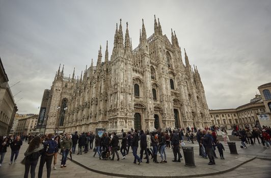 MILAN, ITALY 10 MARCH 2020: Milan Cathedral with tourists and people strolling en masse on the square