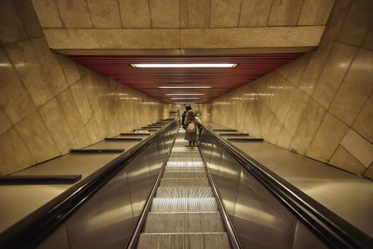 MILAN, ITALY 10 MARCH 2020: Escalators go down to the Milan metro