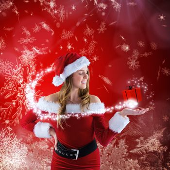 Sexy santa girl presenting with hand against red snow flake pattern design