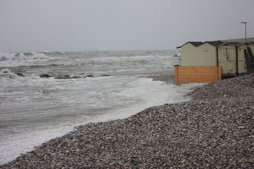 gray storm on small rocks of Liguria in a gloomy tragic day in Italy