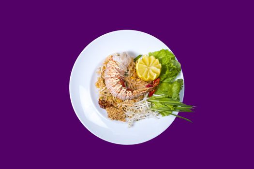 pad thai with lobster. Asian food with purple background and copy space
