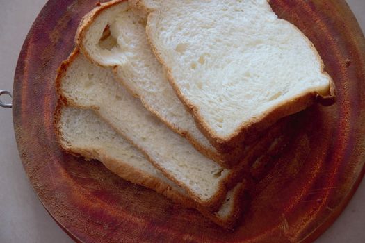 White sliced bread on a board