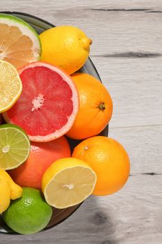 Colorful Assortment Of Citrus Fruit on Wooden Table