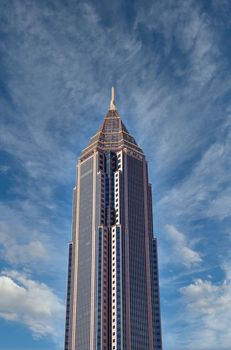 A modern skyscraper under clear blue skies