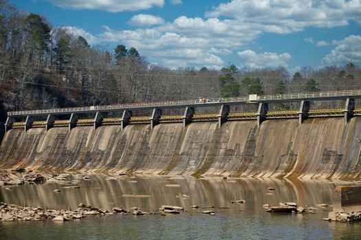 An old concrete hydroelectric dam in a wide river