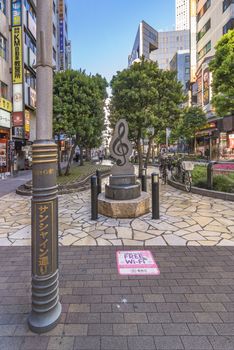 Marble monument shaped in treble clef on Sunshine Street at the east exit of Ikebukuro in Tokyo.
The sidewalk curves emphasized by the blocks embedded with step differing grasses decorate moss stone flowers.
The lyrics of Mr. Sada Masashi's love song "To Toshima Future" of Toshima citizens are engraved on the monument.