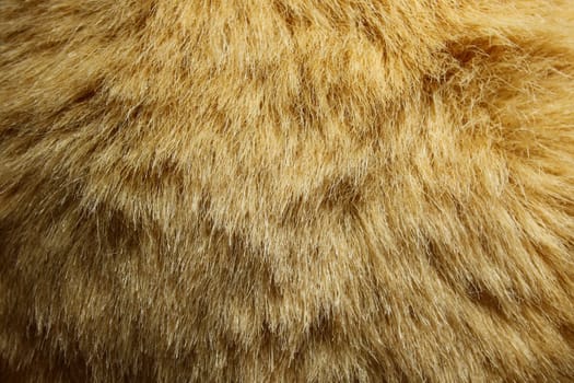 The picture shows a background with brown teddy fur