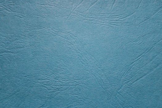 The picture shows a blue background with structured leather