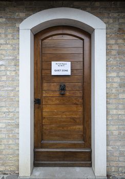 a sign indicating a quiet zone attached on a door