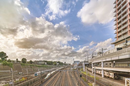 View from the Shimogoindenbashi Bridge called the Train Museum which allows to observe the 2500 trains that pass each day below in the Arakawa district at the north exit of the Nippori Station on the JR Yamanote Line in Tokyo. The bridge dating back to the 1930s has been renovated several times to adapt to the evolution of traffic and was completed in its current form in 1988.