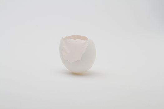egg with the top of the shell broken off with expose inner skin