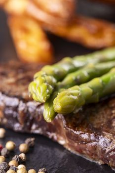 green asparagus on a steak