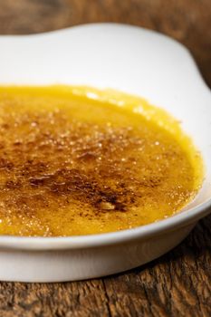 creme brulee on dark wood