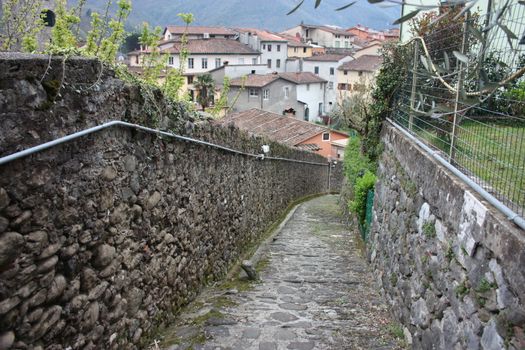 ruined paths built in stone and rock in the Tuscan landscape in Borgo a Mozzano in an ancient medieval village in Italy