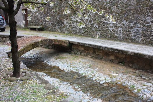 ruined paths built in stone and rock in the Tuscan landscape in Borgo a Mozzano in an ancient medieval village in Italy