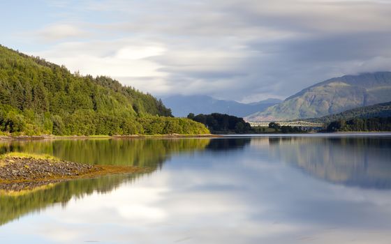 A long exposure of the view across Loch Leven from Ballachulish towards Ballachulish Bridge in the Scottish highlands.  Loch Leven is a sea loch on the west coast of Scotland.