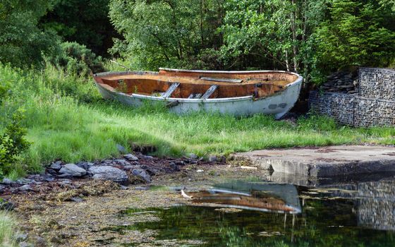 A broken boat is pictured on the banks of Loch Leven in the Scottish highlands.
