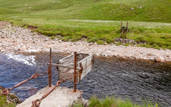 A sheep transporter is pictured crossing the River Etive in Glen Etive, a glen in the Scottish Highlands.