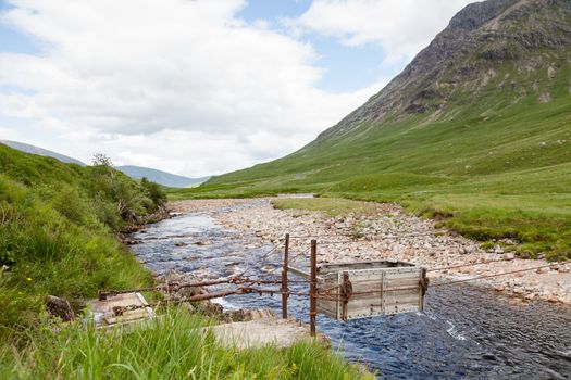 A sheep transporter is pictured crossing the River Etive in Glen Etive, a glen in the Scottish Highlands.