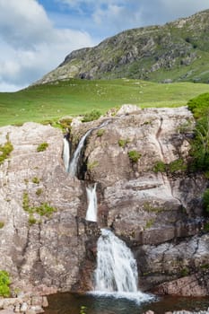 A waterfall in Glencoe in the Scottish highlands.  Glencoe is the most famous of all the Scottish glens.
