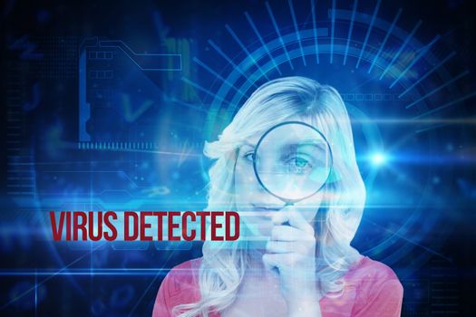 The word virus detected and fair-haired woman looking through a magnifying glass against blue technology interface with dial